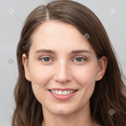 Joyful white young-adult female with long  brown hair and grey eyes