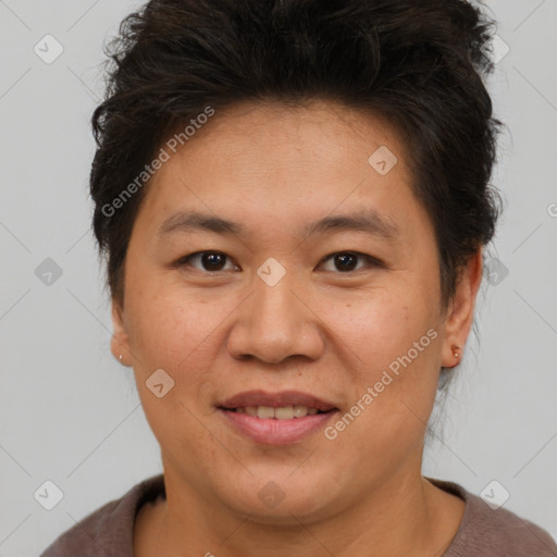 Joyful asian adult female with short  brown hair and brown eyes