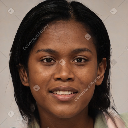 Joyful black young-adult female with long  brown hair and brown eyes