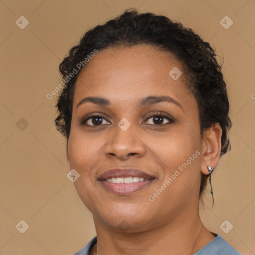 Joyful black young-adult female with medium  brown hair and brown eyes