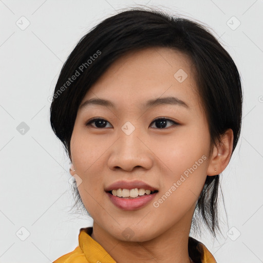 Joyful asian young-adult female with medium  black hair and brown eyes