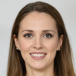 Joyful white young-adult female with long  brown hair and grey eyes