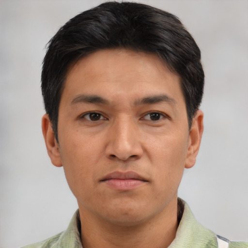 Neutral latino adult male with short  black hair and brown eyes