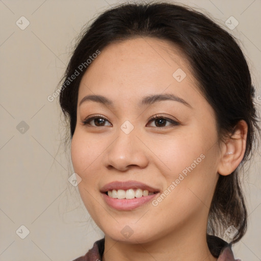 Joyful white young-adult female with medium  brown hair and brown eyes