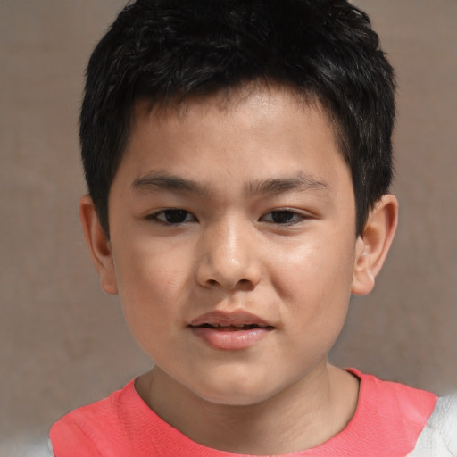 Joyful asian child male with short  brown hair and brown eyes