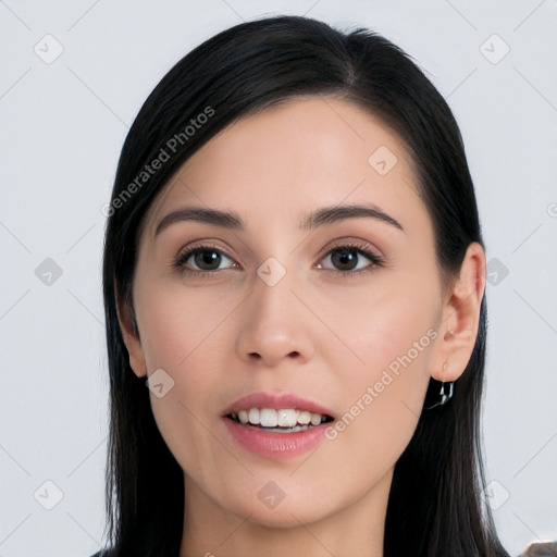 Joyful white young-adult female with long  black hair and brown eyes