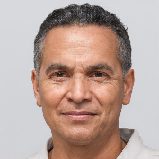 Joyful white middle-aged male with short  black hair and brown eyes