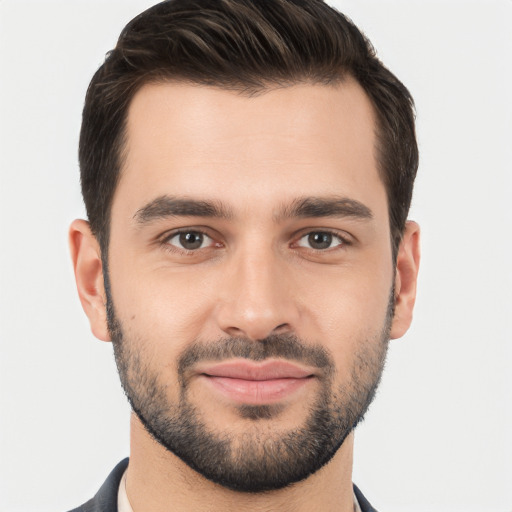 Joyful white young-adult male with short  brown hair and brown eyes