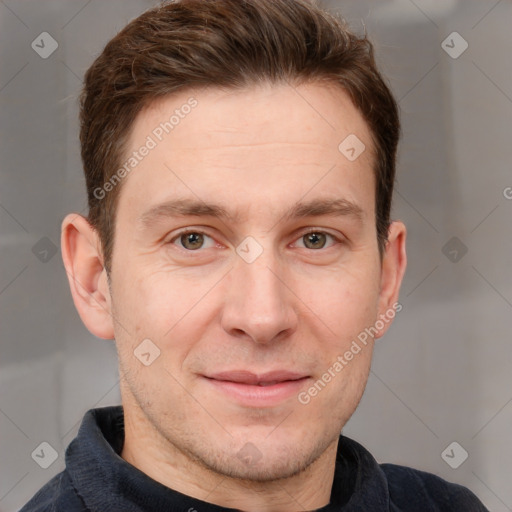 Joyful white adult male with short  brown hair and grey eyes