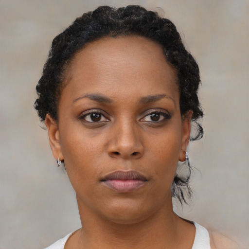 Neutral black young-adult female with short  black hair and brown eyes