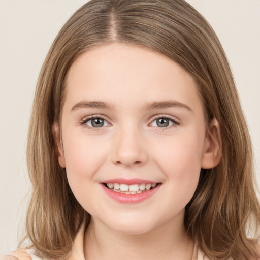 Joyful white child female with medium  brown hair and grey eyes