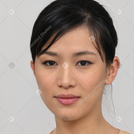 Joyful asian young-adult female with short  brown hair and brown eyes