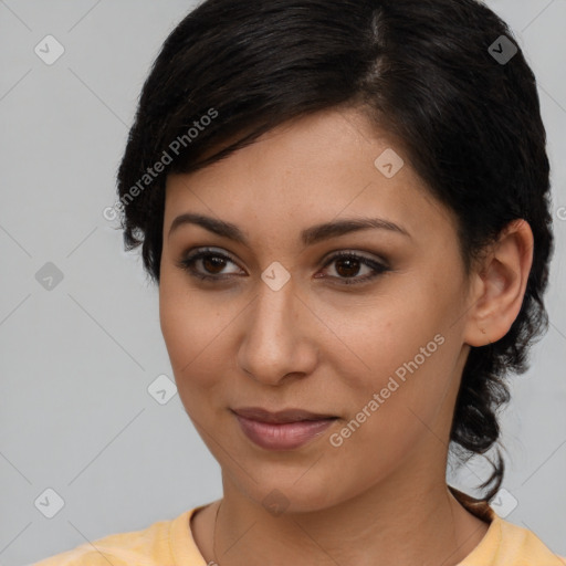 Joyful latino young-adult female with medium  brown hair and brown eyes