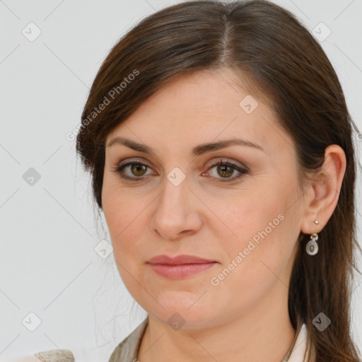 Joyful white young-adult female with long  brown hair and brown eyes