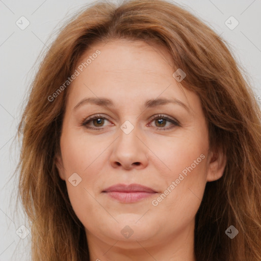 Joyful white adult female with long  brown hair and brown eyes