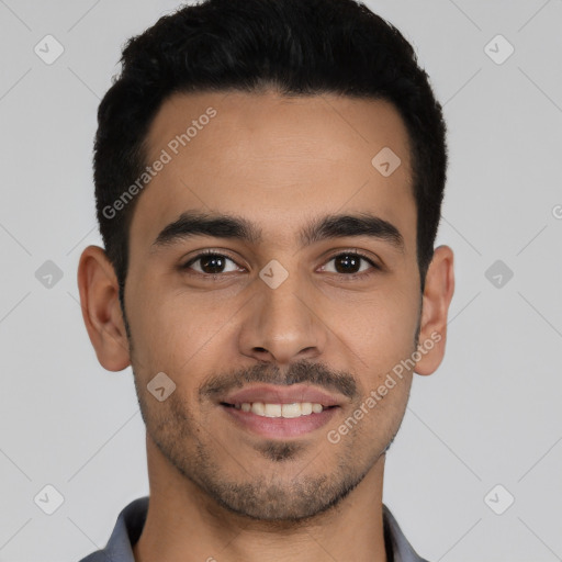 Joyful latino young-adult male with short  black hair and brown eyes