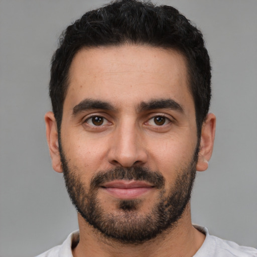 Neutral white young-adult male with short  black hair and brown eyes