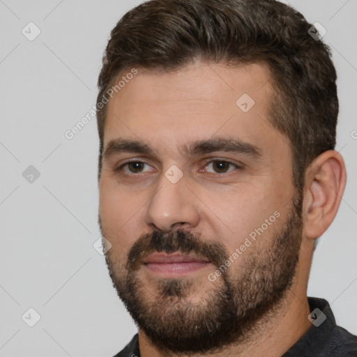 Joyful white young-adult male with short  brown hair and brown eyes