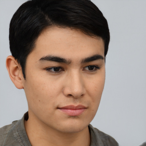 Neutral asian young-adult male with short  brown hair and brown eyes
