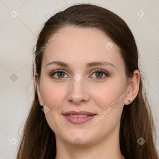 Joyful white young-adult female with long  brown hair and grey eyes