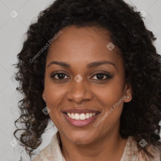 Joyful black young-adult female with medium  brown hair and brown eyes