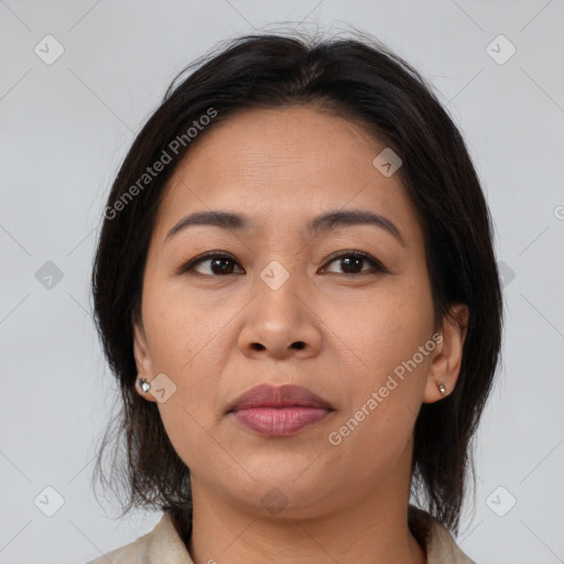 Joyful asian young-adult female with medium  brown hair and brown eyes