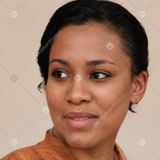 Joyful black young-adult female with short  black hair and brown eyes