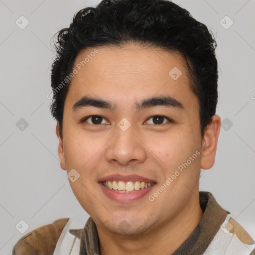 Joyful latino young-adult male with short  brown hair and brown eyes