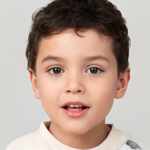 Joyful white child male with short  brown hair and brown eyes