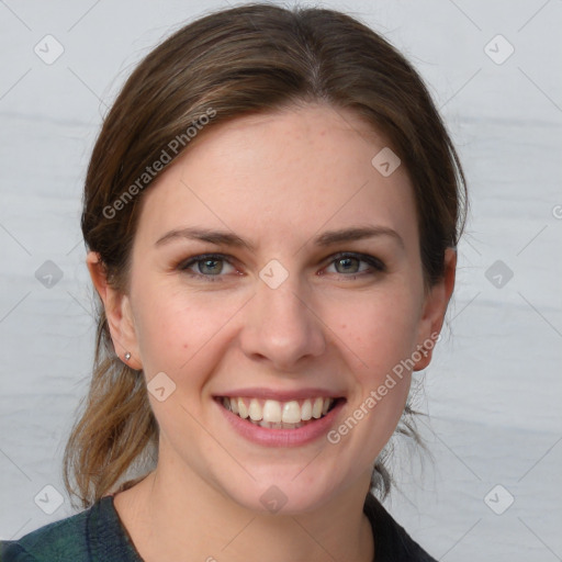 Joyful white young-adult female with medium  brown hair and grey eyes