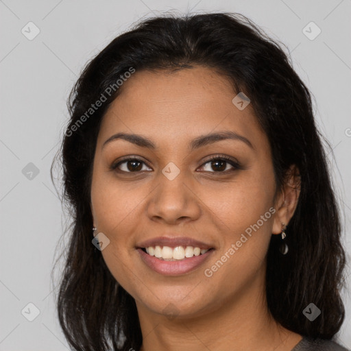 Joyful latino young-adult female with long  brown hair and brown eyes