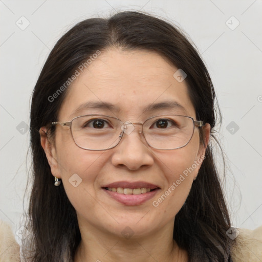 Joyful white adult female with long  brown hair and brown eyes