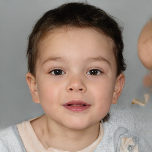 Joyful white child female with short  brown hair and blue eyes