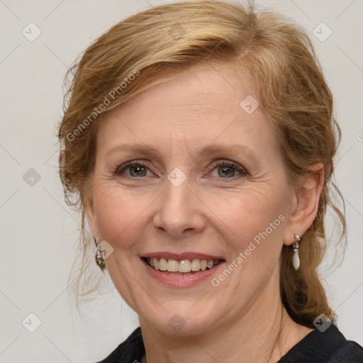 Joyful white adult female with medium  brown hair and blue eyes