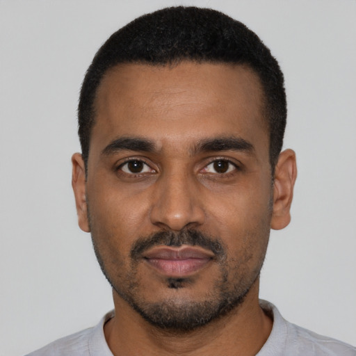 Neutral black young-adult male with short  black hair and brown eyes
