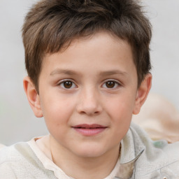 Joyful white child male with short  brown hair and brown eyes