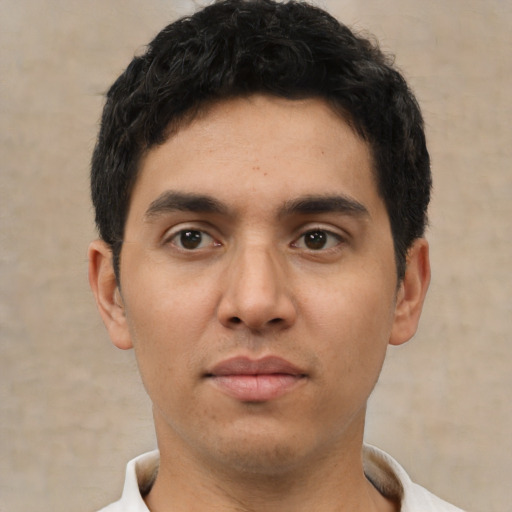 Neutral white young-adult male with short  black hair and brown eyes