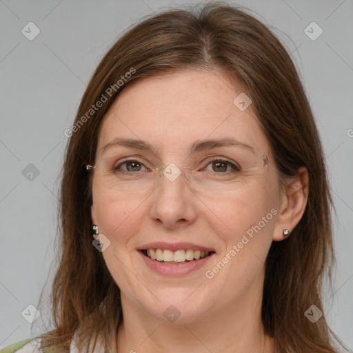 Joyful white adult female with medium  brown hair and grey eyes