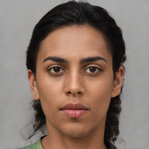 Neutral latino young-adult female with medium  brown hair and brown eyes