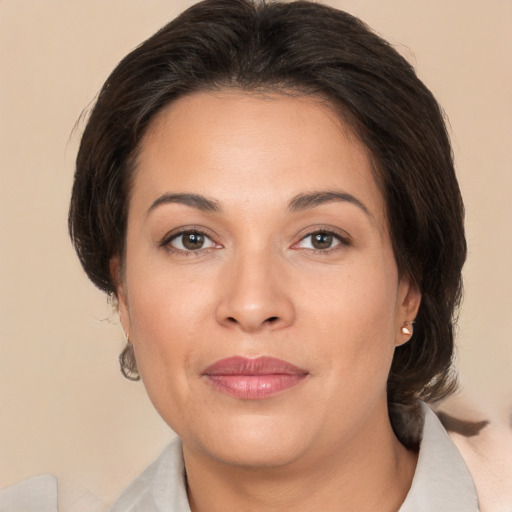 Joyful white adult female with medium  brown hair and brown eyes