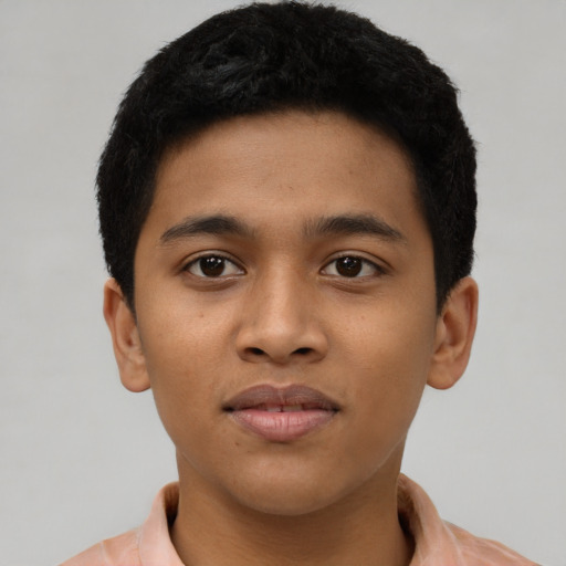 Joyful latino young-adult male with short  brown hair and brown eyes