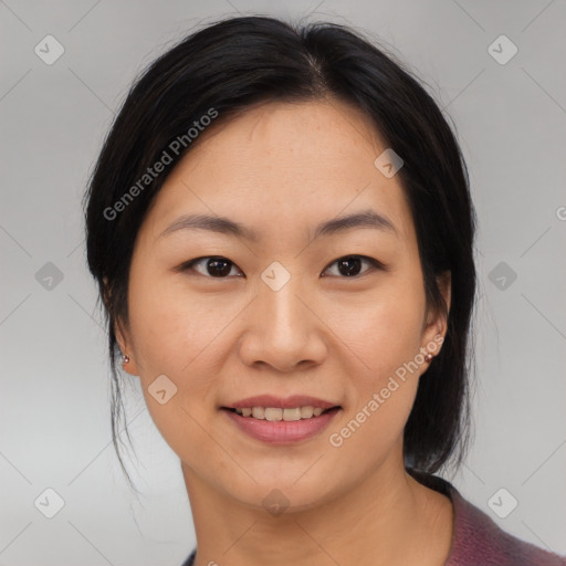 Joyful asian young-adult female with medium  black hair and brown eyes