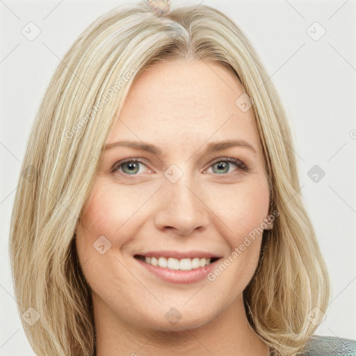 Joyful white young-adult female with long  brown hair and blue eyes