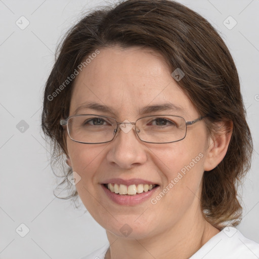 Joyful white adult female with medium  brown hair and brown eyes