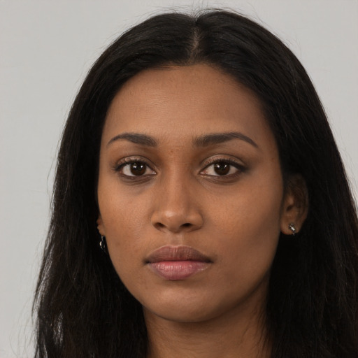 Neutral black young-adult female with long  black hair and brown eyes