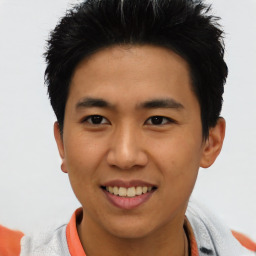 Joyful asian young-adult male with short  black hair and brown eyes