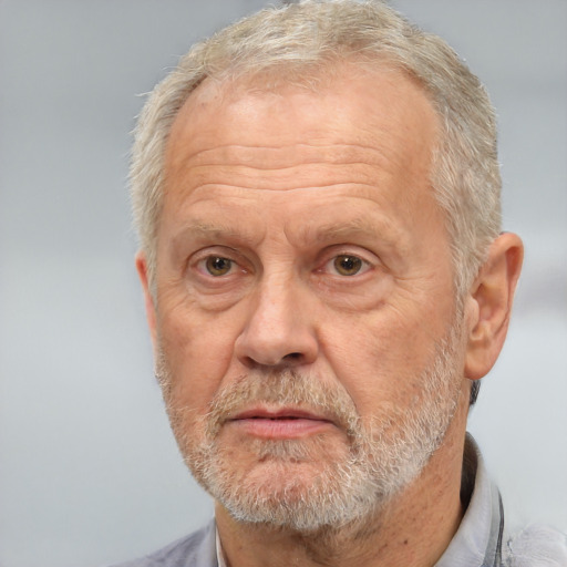 Neutral white middle-aged male with short  gray hair and brown eyes