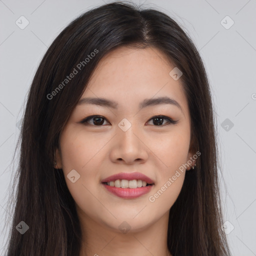 Joyful asian young-adult female with long  brown hair and brown eyes