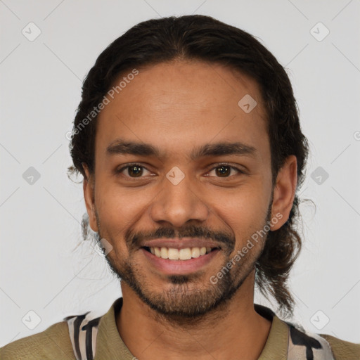 Joyful latino young-adult male with short  black hair and brown eyes