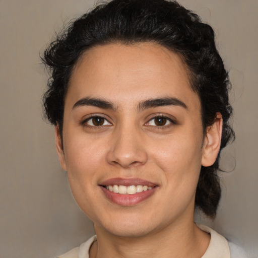 Joyful white young-adult female with medium  brown hair and brown eyes